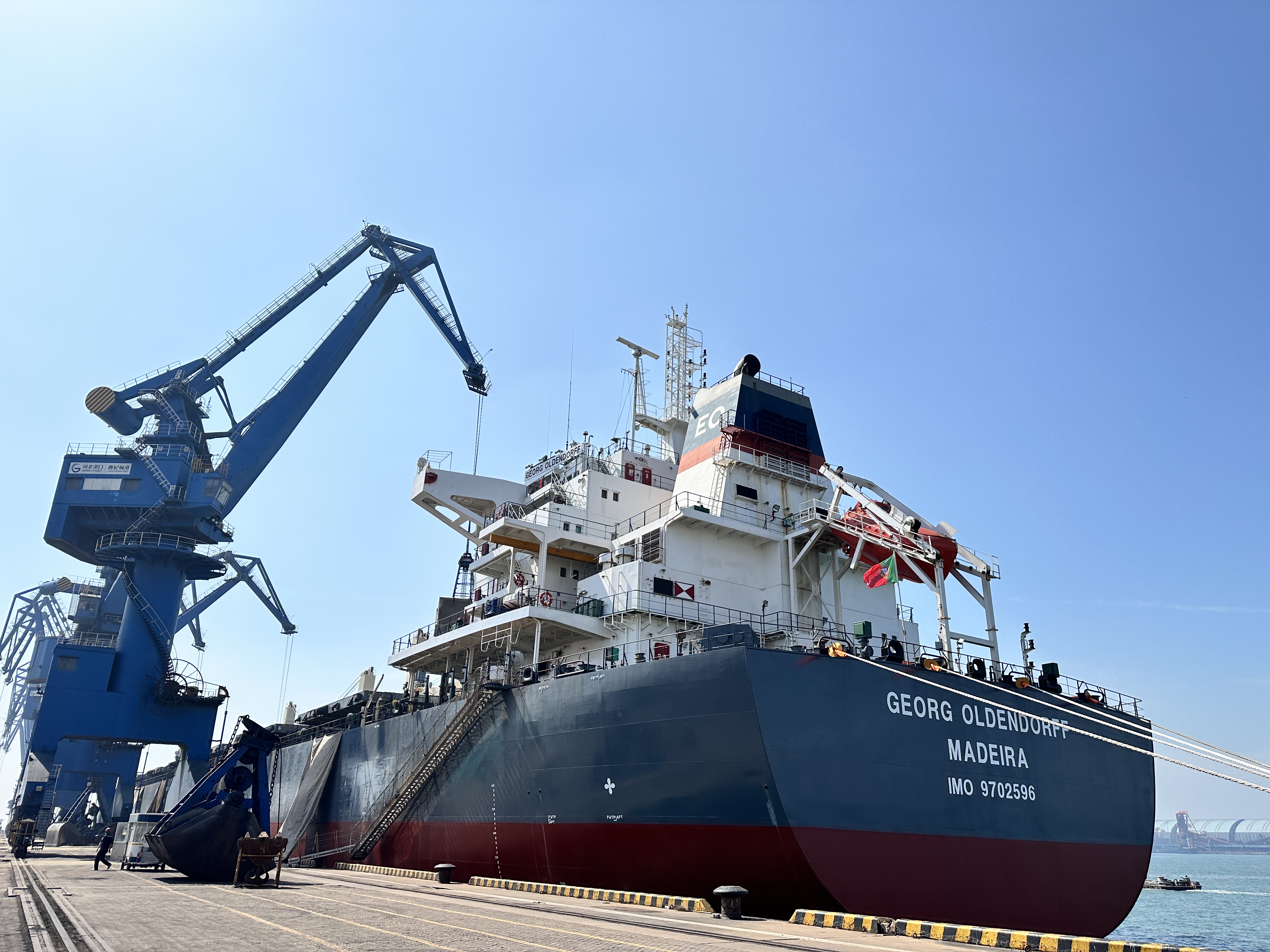 Bulk vessel and port loading scene