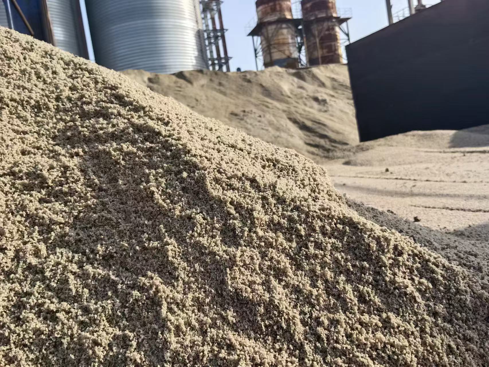 Dry bulk vessel loading slag and cementitious materials at Chinese port for global export