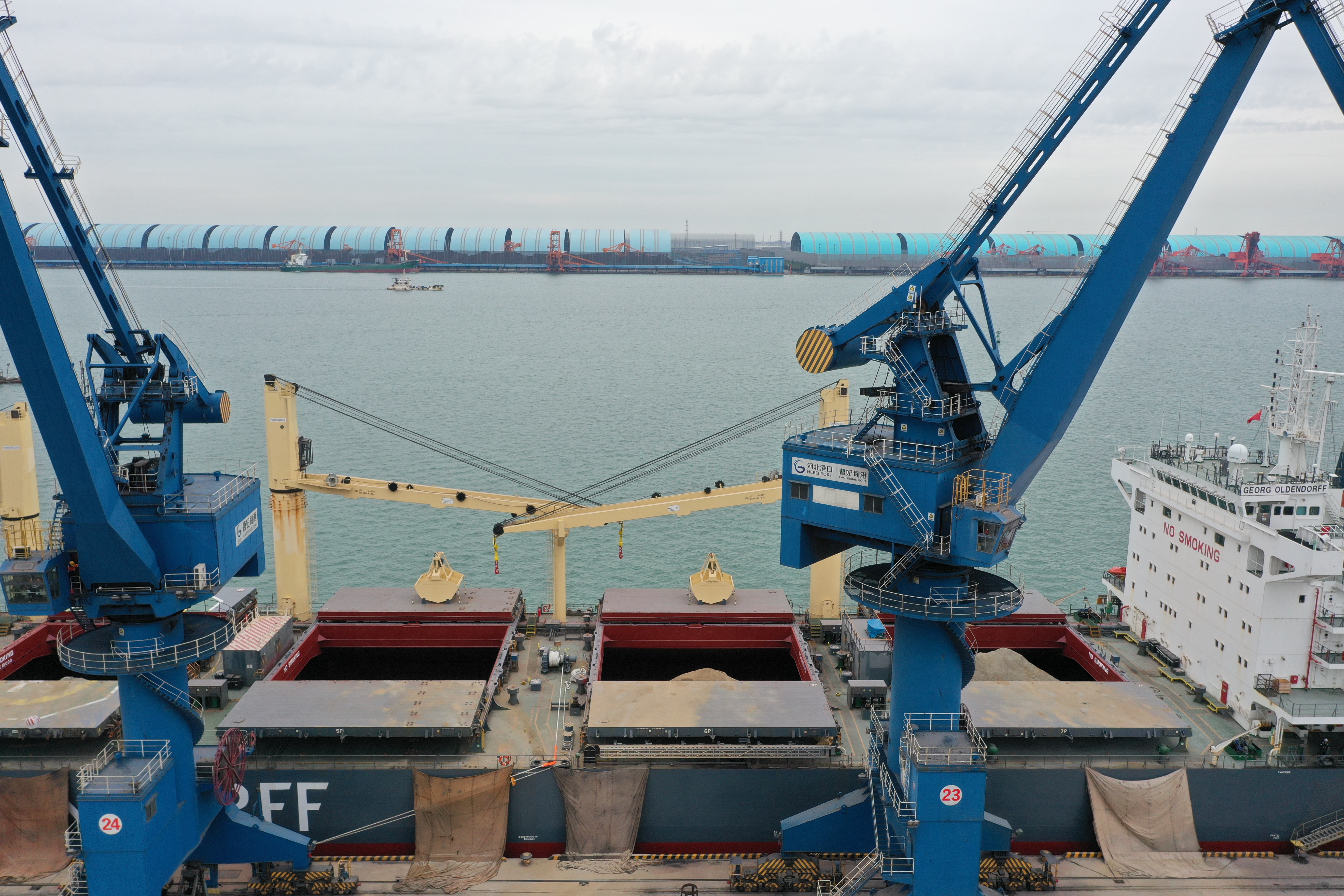 Eritrean port terminal with bulk cargo handling infrastructure and Red Sea backdrop