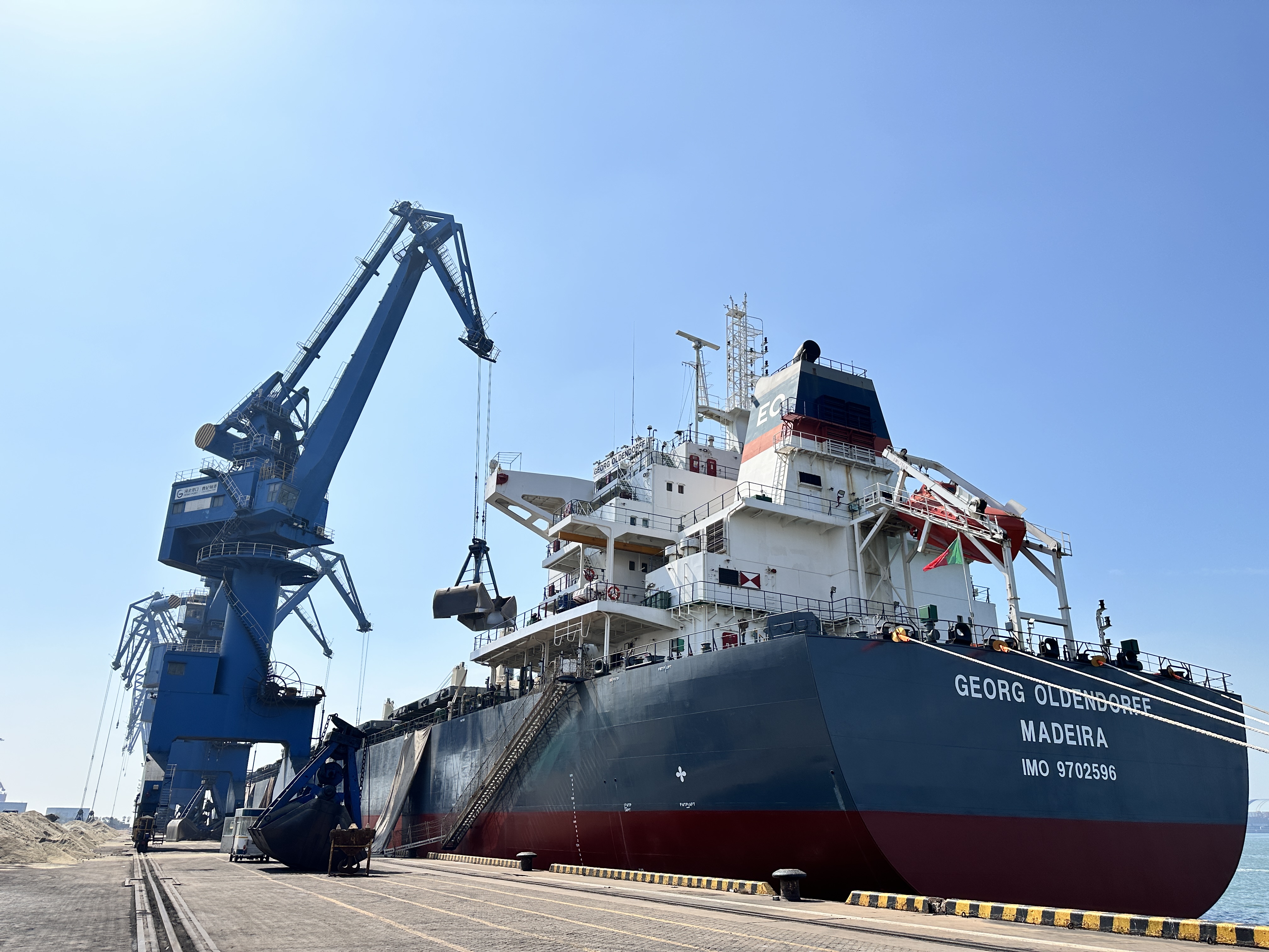 Southeast Asia bulk export terminal loading cementitious materials onto a vessel